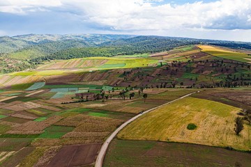 Aerial view of patchwork smallholder farm plots on rolling hills in Mau Narok, Nakuru County, Kenya